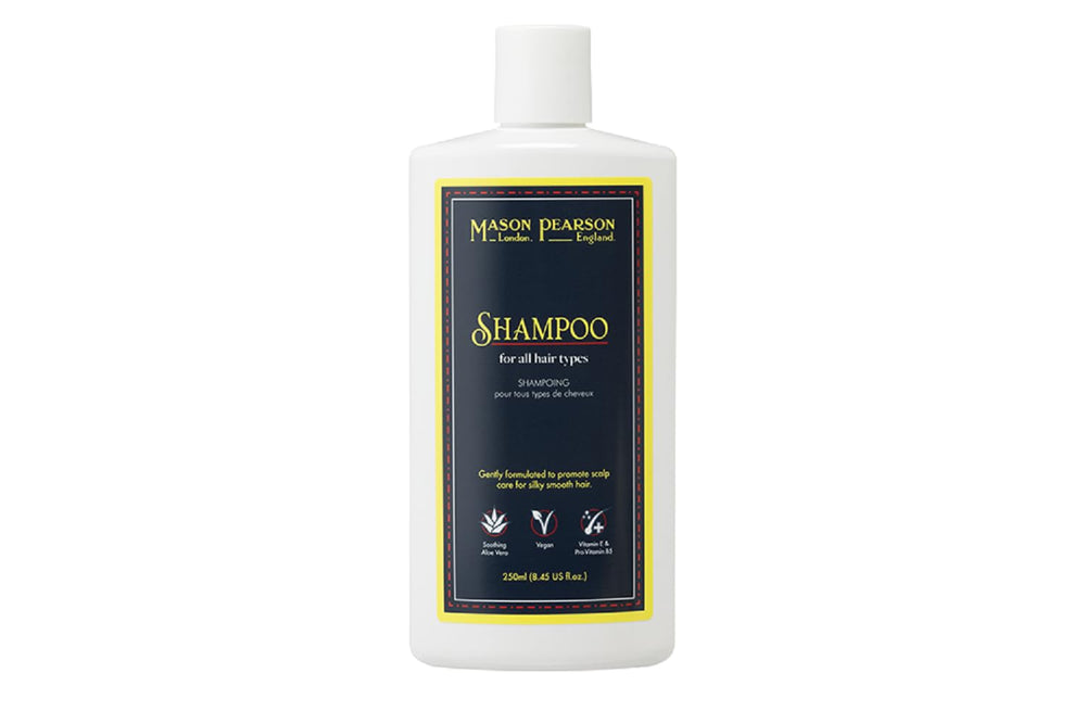 Mason Pearson Shampoo bottle being poured for all hair types, showcasing hydration and gentle cleansing.