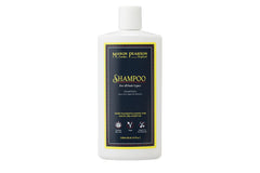 Mason Pearson Shampoo bottle being poured for all hair types, showcasing hydration and gentle cleansing.