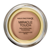 MAX FACTOR Miracle Touch Foundation bottle pour showcases smooth, even coverage