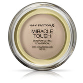 Max Factor Miracle Touch Foundation Creamy Ivory 040 bottle pour for even coverage