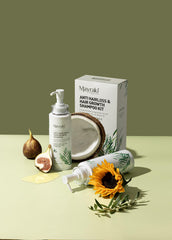 Mayraki Professional color-treated hair in bathroom mirror, gentle cleanse supports color longevity.