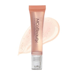 MCoBeauty Glow Treat lip oil with peach scent and rollerball for quick glossy shine.