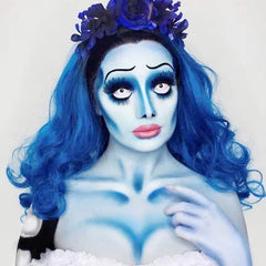 Brush applies MEICOLY light blue face paint for smooth blending.