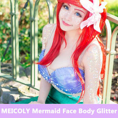 MEICOLY Mermaid-glitter-face on the cheek adds vibrant festival glow.