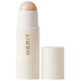 Merit Day Glow Dewy Highlighting Balm Cava bottle close-up for natural daytime radiance