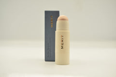 Merit Day Glow Dewy Highlighting Balm Cava swatch on skin for lightweight radiant finish