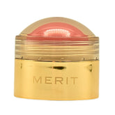 Merit Flush Balm Lusitano Soft Peach bottle shows creamy texture for quick glow.