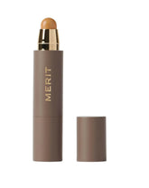 MERIT Minimalist Foundation Stick Camel application close-up shows buildable coverage.