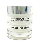 Merle Norman Daily Moisture Cream jar close-up showing rich texture for deep hydration.