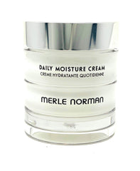 Merle Norman Daily Moisture Cream jar close-up showing rich texture for deep hydration.