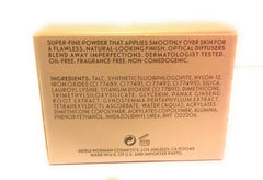 Merle Norman Flawless Effect Loose Powder Nearly Nude glow-finish for subtle radiance.