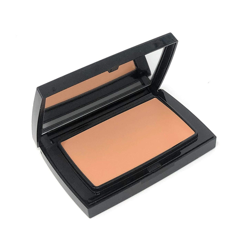 Merle Norman Total Finish Creamy Beige compact foundation provides a long-wearing matte finish for dry skin.