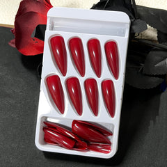 MERVF red acrylic press-on nails in stiletto shape for dramatic styling