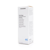 Mesoestetic Tricology bottle viewed up close, supports scalp care and fuller-looking hair.