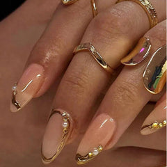 Meticula 3D gold line pearls rhinestones detail enhances daily nail aesthetics.