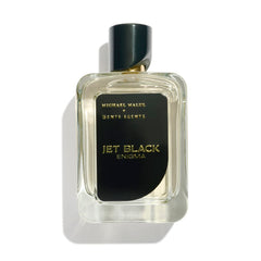 Michael Malul Jet Black Enigma bottle on a dark bar counter, commanding attention.