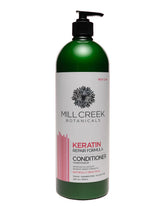 Mill Creek Keratin Conditioner bottle; promotes strength and elasticity.