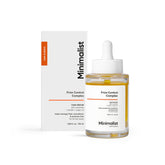Minimalist Frizz Control serum bottle in use for smoother strands.