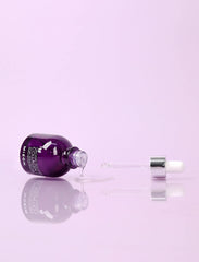 Applying MIZON Collagen 100 ampoule for smoother, radiant skin.