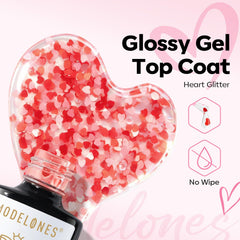 Close-up of red and pink heart sequins on Modelones top coat nails