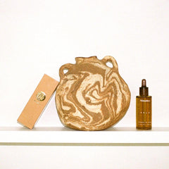 Monastery rare sandalwood nut oil closeup highlights nourishing oil for calm skin.