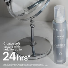 MONAT Moxie Magnifying Mousse in use while blow-drying for added lift.