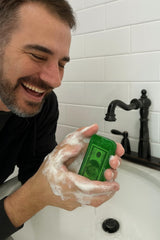 Money Soap handmade small-batch bar displayed in a bathroom scene for premium skin feel.