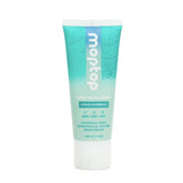 MopTop Curl Cream bottle closeup showing sleek packaging and frizz-control promise.