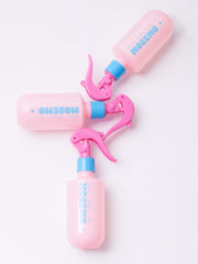 Moremo No-Wash Keratin Ampoule spray nozzle close-up demonstrating precise, targeted use on damp strands