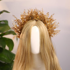 MOSTORY Handmade craftsmanship highlights a detailed floral halo on a regal headpiece.