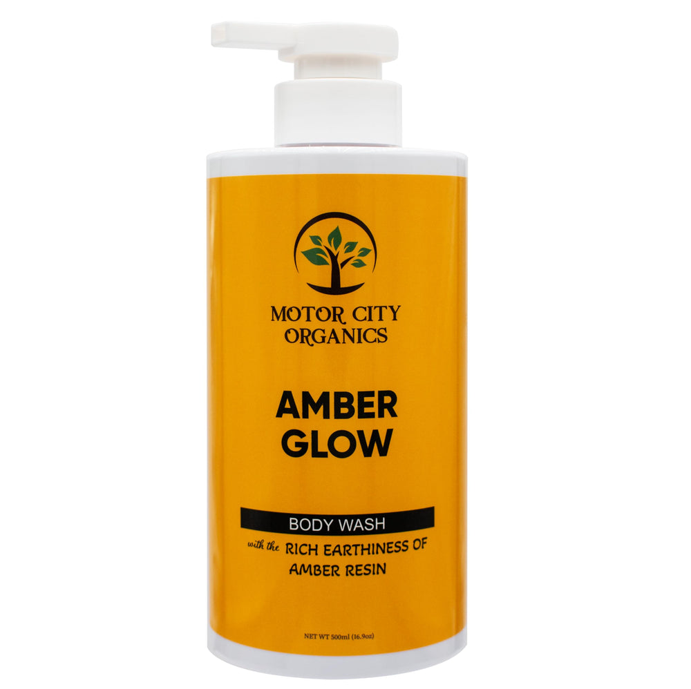 Motor City Organics Amber Glow bottle pour shows a creamy, moisturizing texture for cleansing.