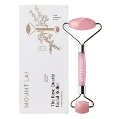 Mount Lai rose quartz facial roller close-up highlighting dual ends for calming facial massage