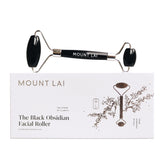 Mount Lai Warming Black Obsidian Roller on the face for improved circulation and relaxation