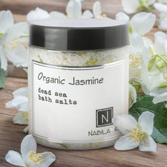 Nabila K Organic Jasmine Bath Salts in a relaxing bath scene.