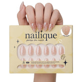 Nailique glazed donut nails in almond chrome nude with white polka dots for wedding-ready style.