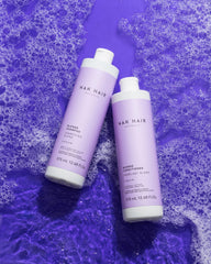 NAK Hair Australia Blonde Conditioner package in bathroom, enhances natural blonde and protects cuticles.
