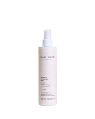NAK Hair Hydrate Detangle Mist bottle ready for detangling and moisture boost.