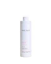 NAK Hair Hydrate Shampoo bottle front showing a moisturising formula for dry and colour-treated hair.