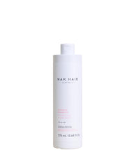 NAK Hair Hydrate Shampoo bottle front showing a moisturising formula for dry and colour-treated hair.