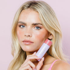 Close-up texture of Naked Sundays Glow Balm with peptide-rich formula.