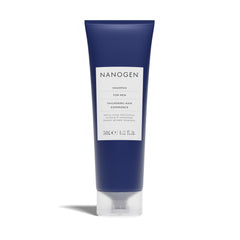 Close-up of Nanogen Thickening Shampoo for Men bottle being squeezed for dispensing.