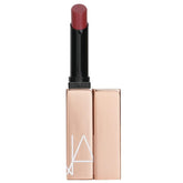 NARS Afterglow Sensual Shine Lipstick Turned On swatch shows luminous color and smooth hydration