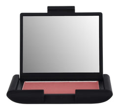 Close-up of applying NARS Dolce Vita blush highlighting buildable color and weightless texture.