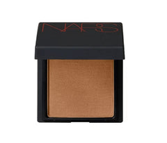 NARS Laguna bronzing powder swirl on cheek for subtle warmth and contour.