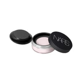 NARS Light Reflecting Prismatic Powder Milky Way lavender loose powder adds soft, luminous glow.