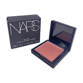 NARS Orgasm mini blush compact shows peachy pink with golden shimmer for radiant cheeks.