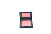 NARS Orgasm X travel-size compact powder for on-the-go radiant color and touch-ups.