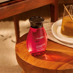 NATIVA SPA Plum Body Oil applied on skin for velvety softness.