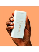 Native travel size body wash bottle with Sweet Peach Nectar scent for a refreshing cleanse