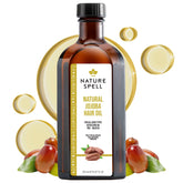 Nature Spell Jojoba Oil bottle close-up showing rich oil for scalp moisture and shine.